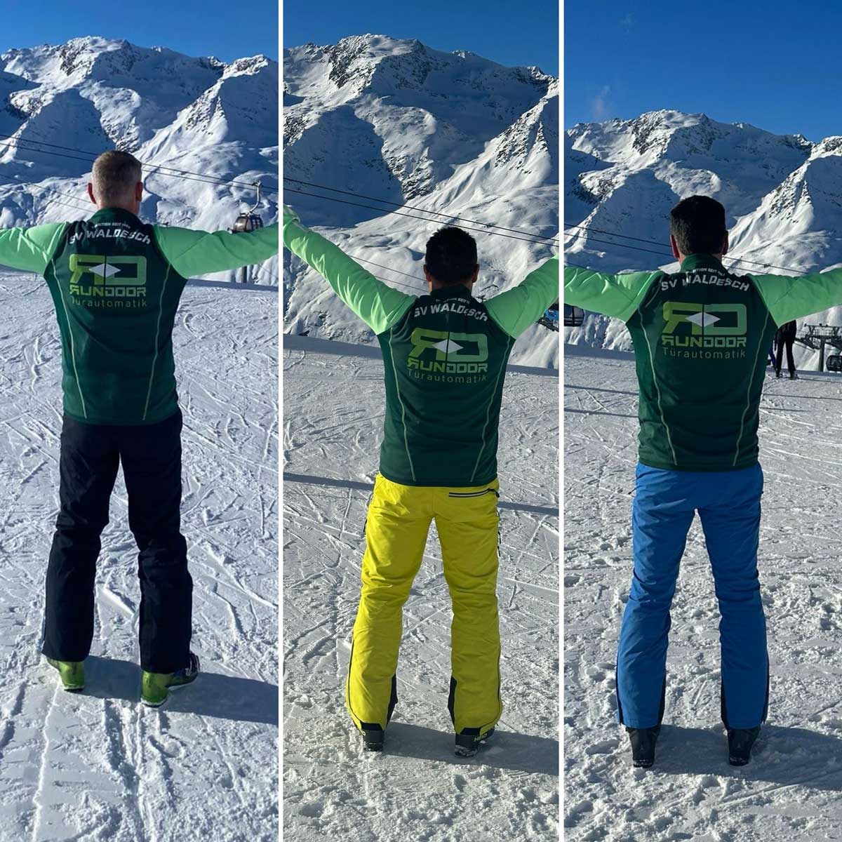 Trikot auf Tour - Drei Männer mit ausgebreiteten Armen im Schnee. Im Hintergrund ein Skilift.